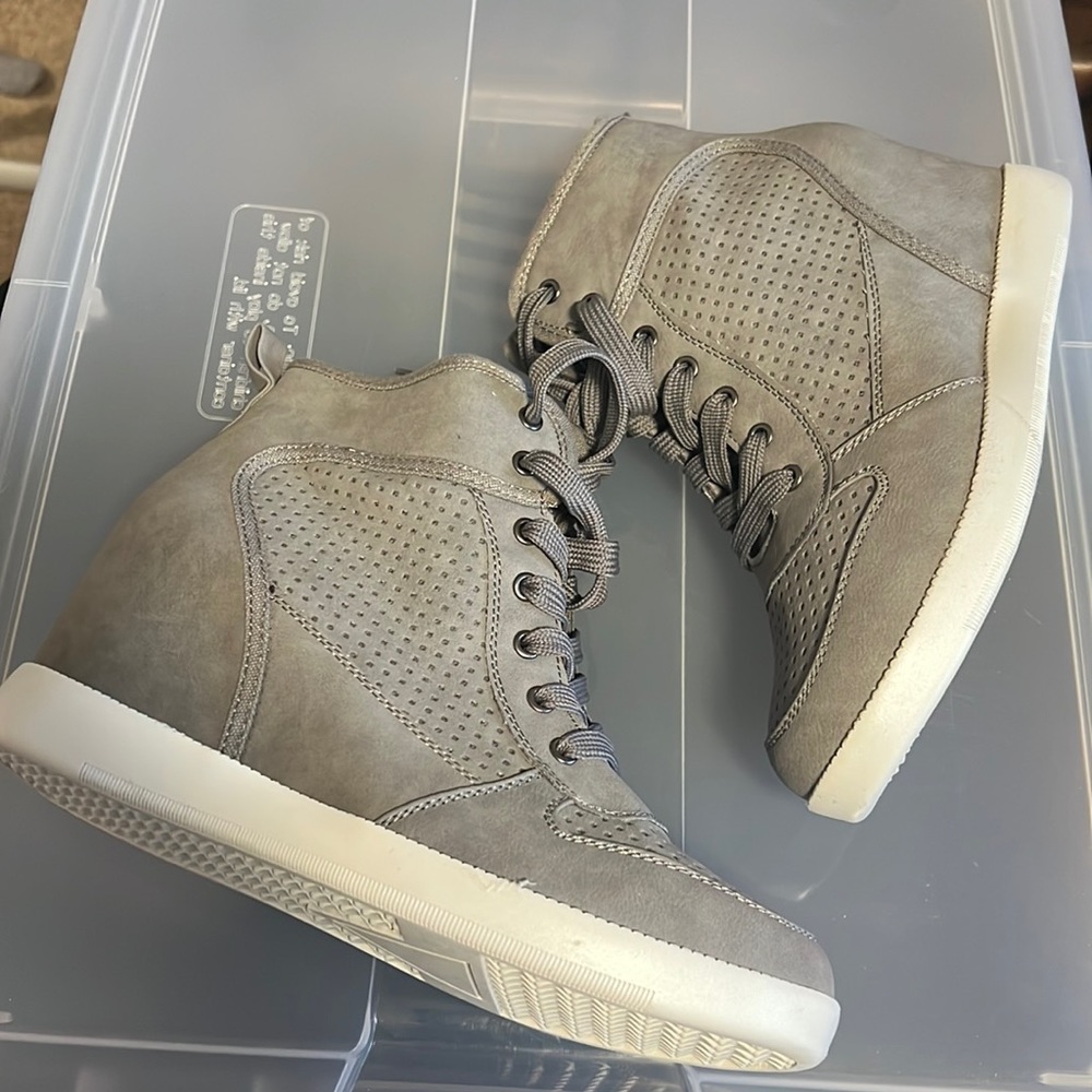 Gently worn grey heeled sneaker